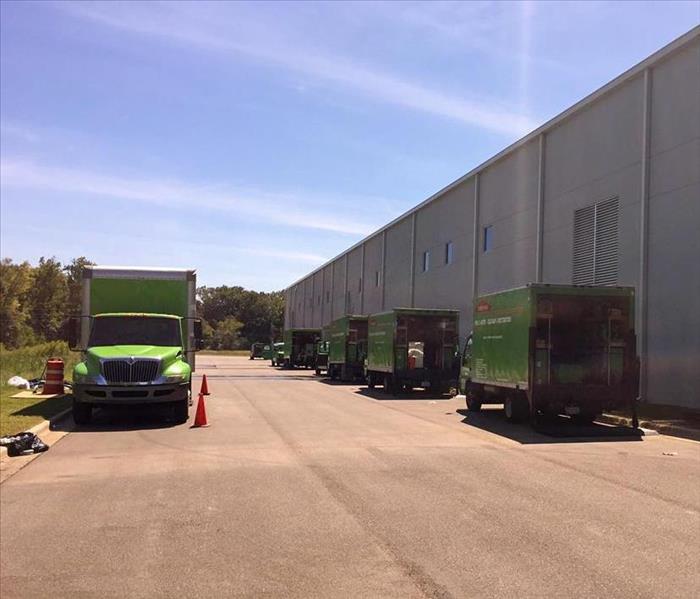 SERVPRO trucks parked behind a Buford business