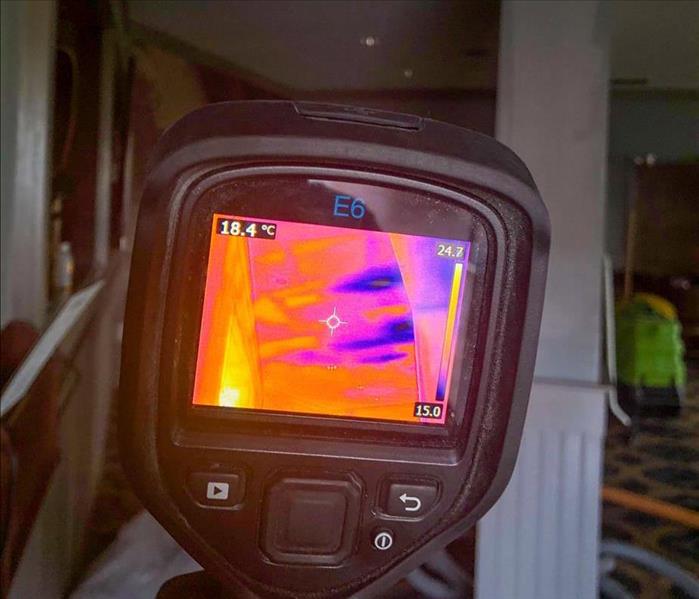 Infrared camera looking for hidden moisture.